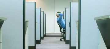 worker seated in office cubicle