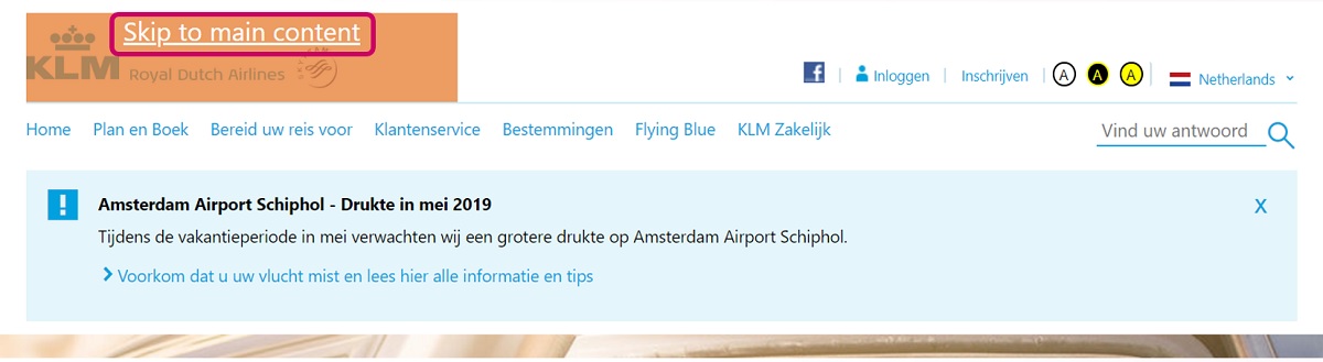 Clip of KLM website with focus on skip to main content button 
