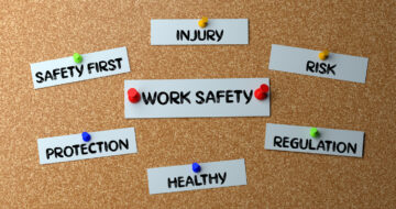 Words pinned to a cork board - Injury, Safety First, Work Safety, Risk, Protection, Healthy and regulation
