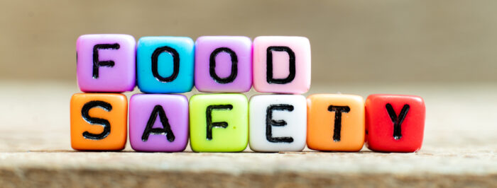 (alt="colourful blocks with the words, food safety")